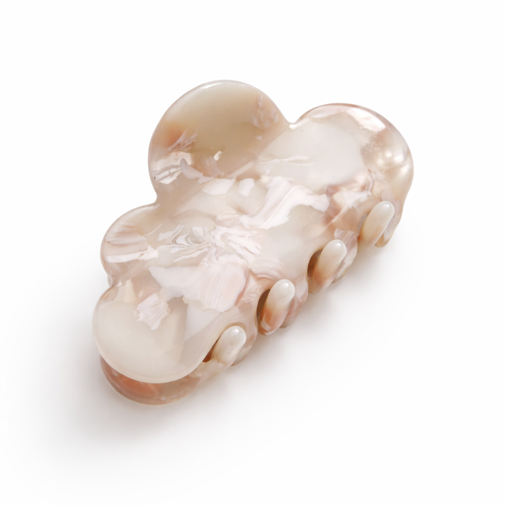 Decorative hair clip with floral design on a white background