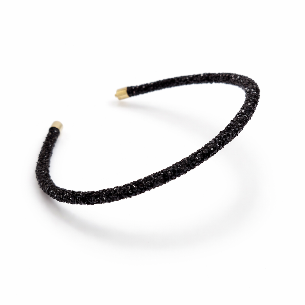 Black beaded headband on a white background