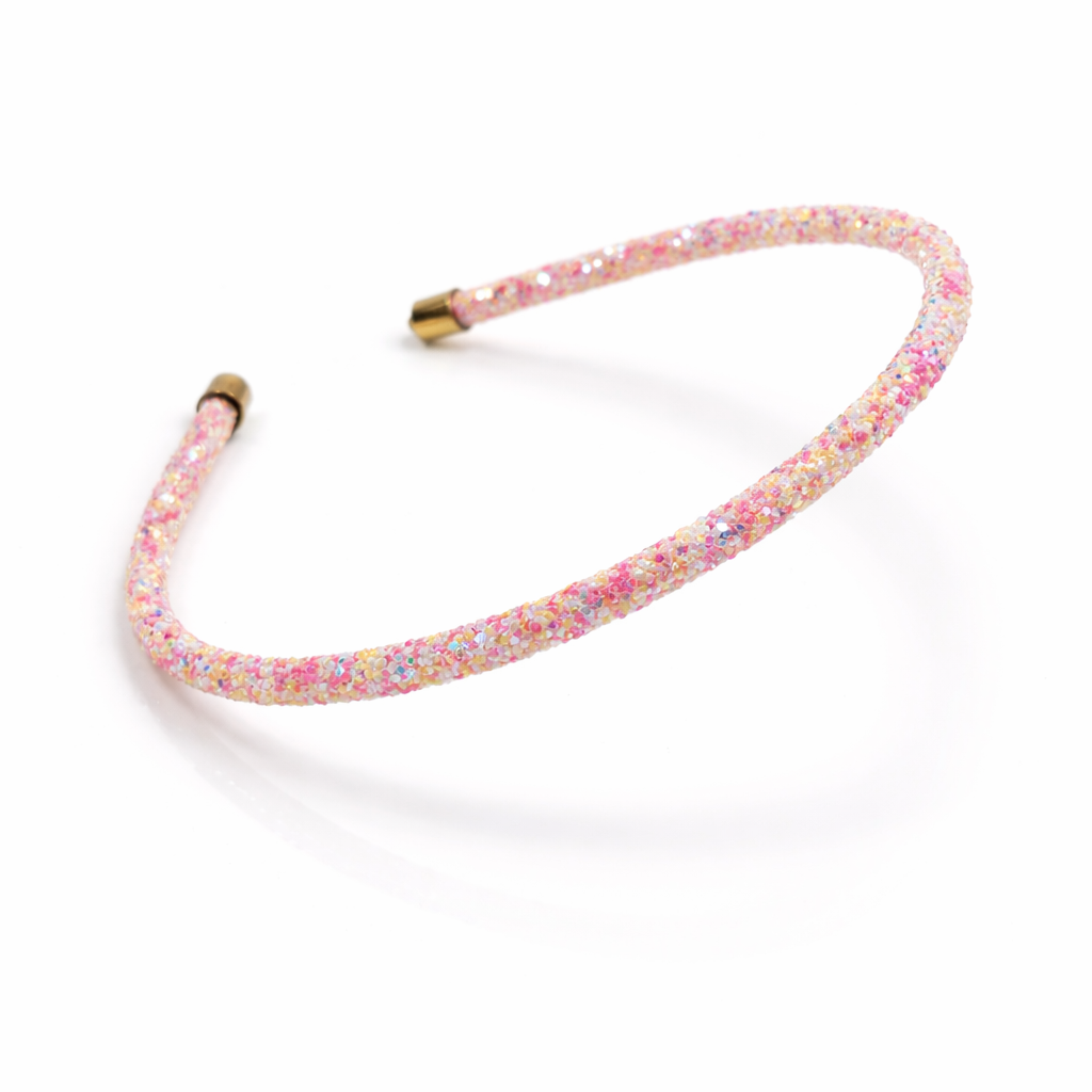 Pink floral headband on a white background