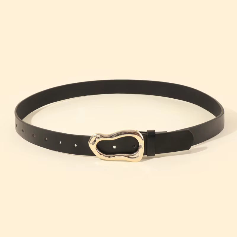 Black belt with a gold buckle on a beige background