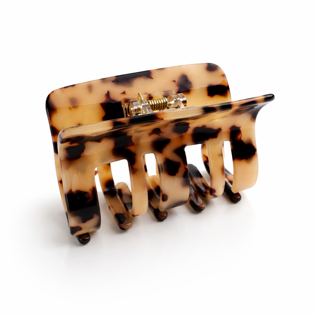 Tortoiseshell hair clip on a white background
