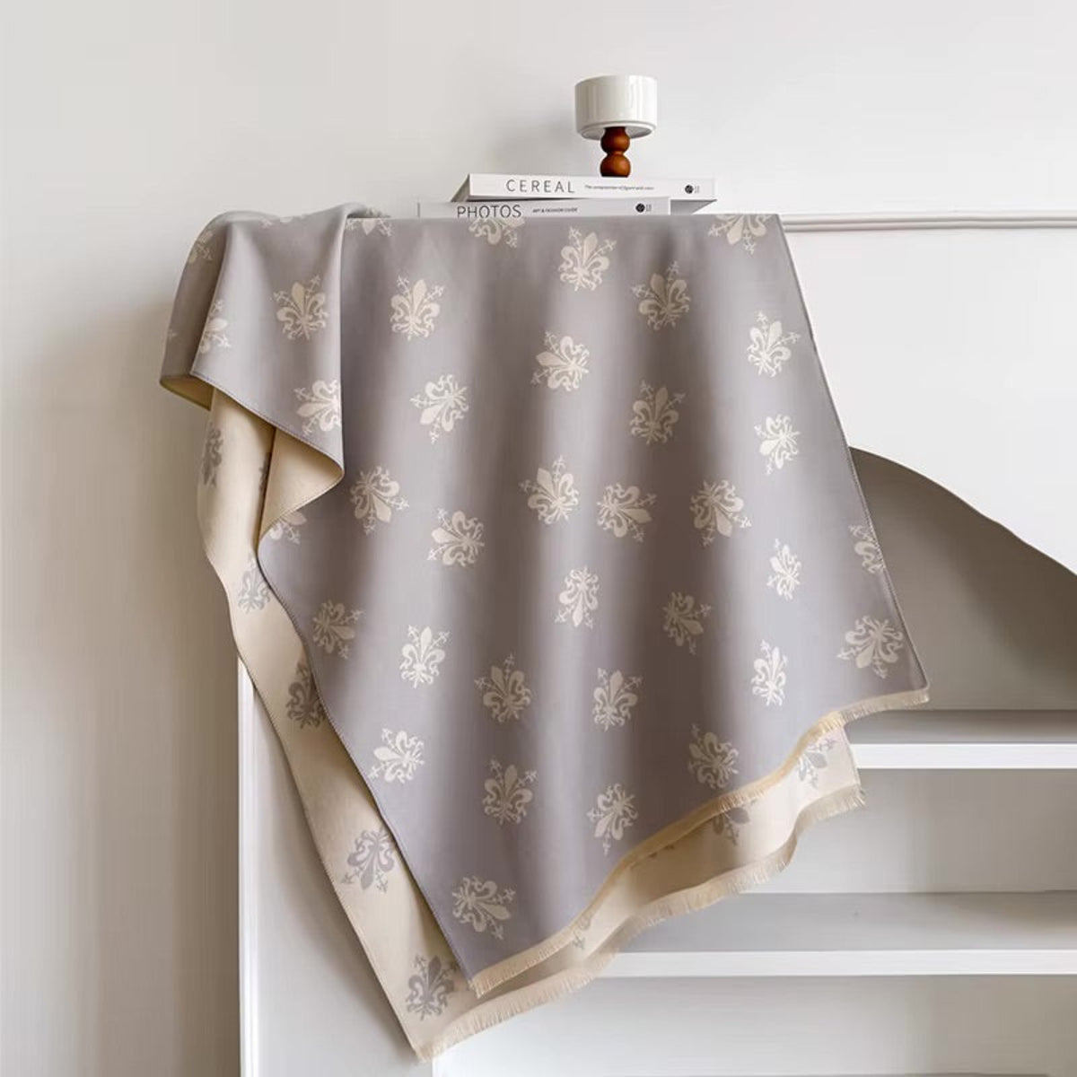 Decorative gray fabric with floral patterns on a white background