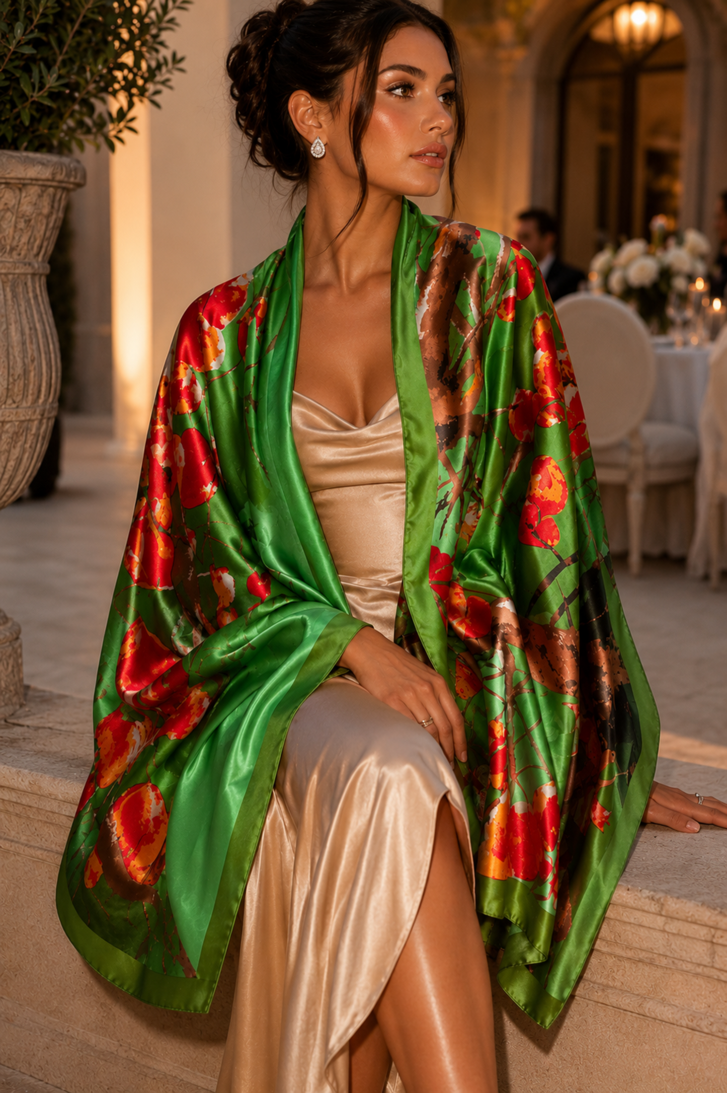 Woman wearing a green floral kimono in an elegant indoor setting