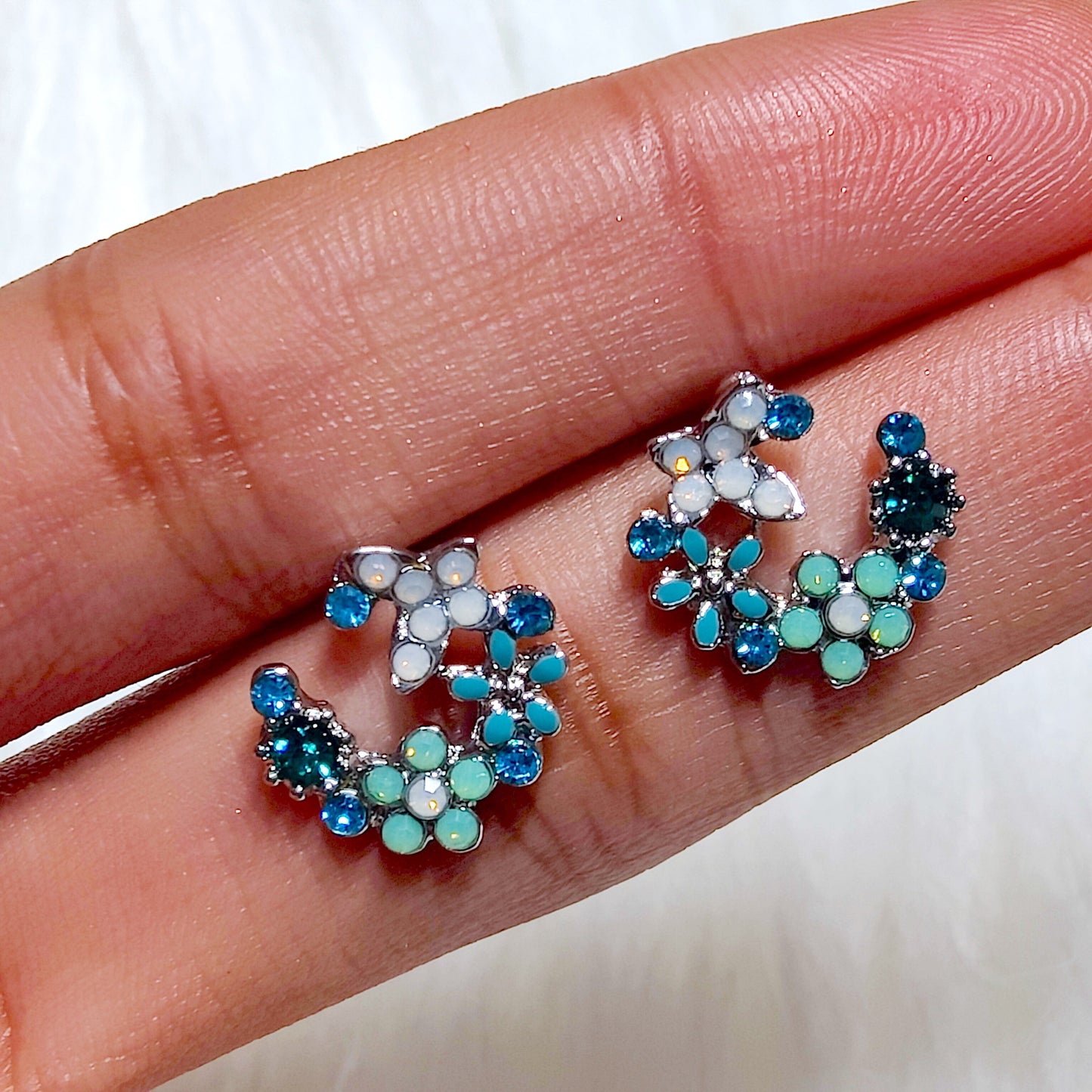 Lumi studs in Blue and Green