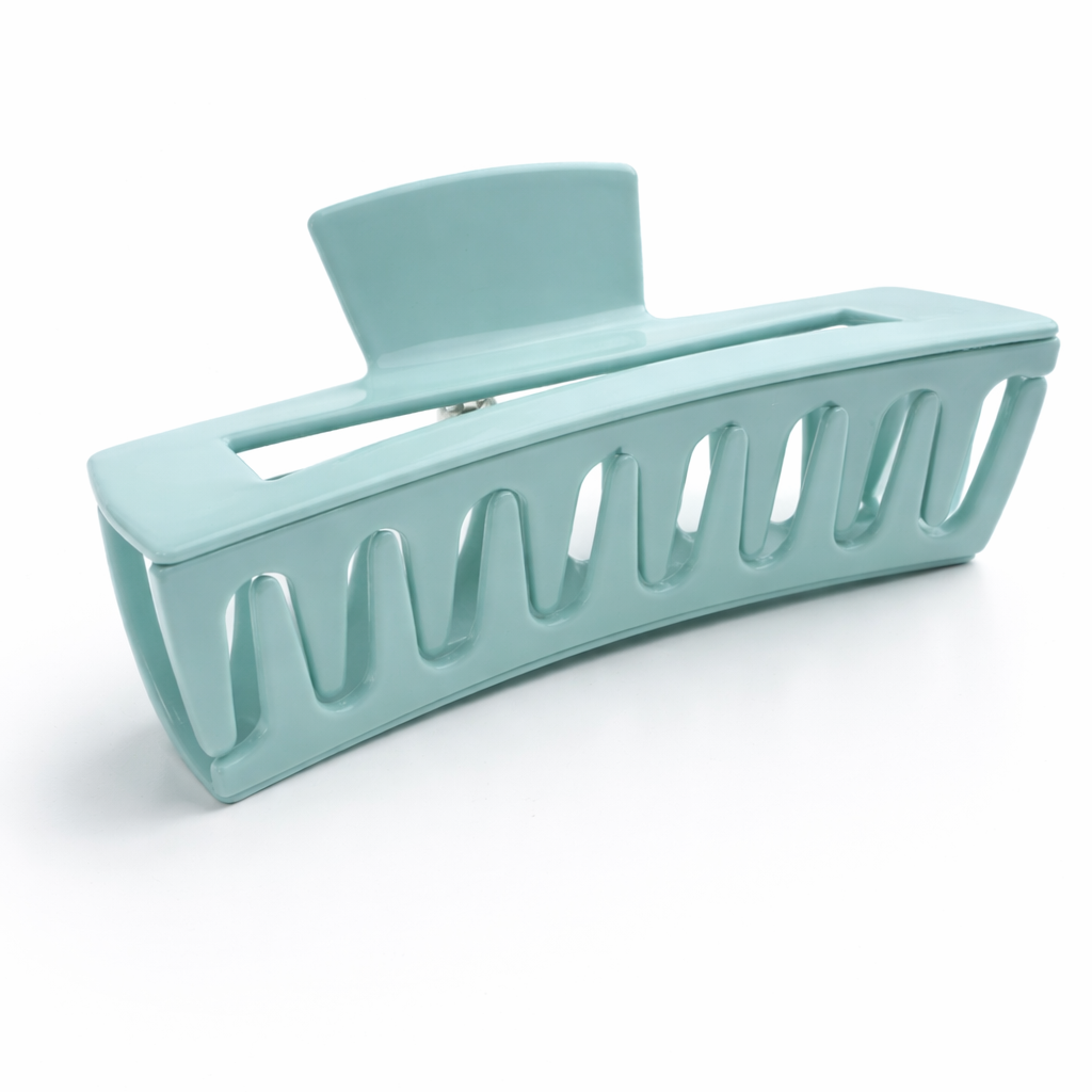 Light blue hair clip on a white background