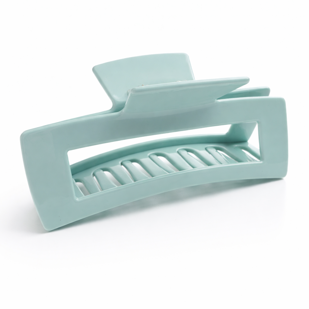 Light blue hair clip on a white background