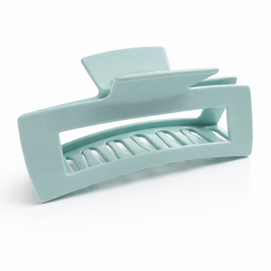 Light blue hair clip on a white background