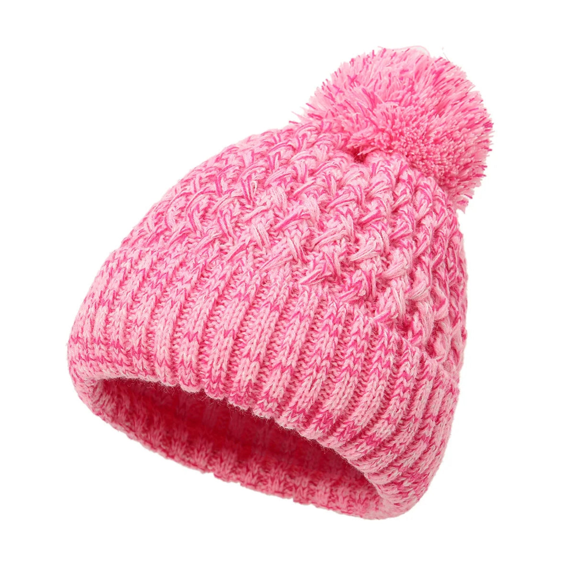 Pink knitted beanie with a pom-pom on a white background