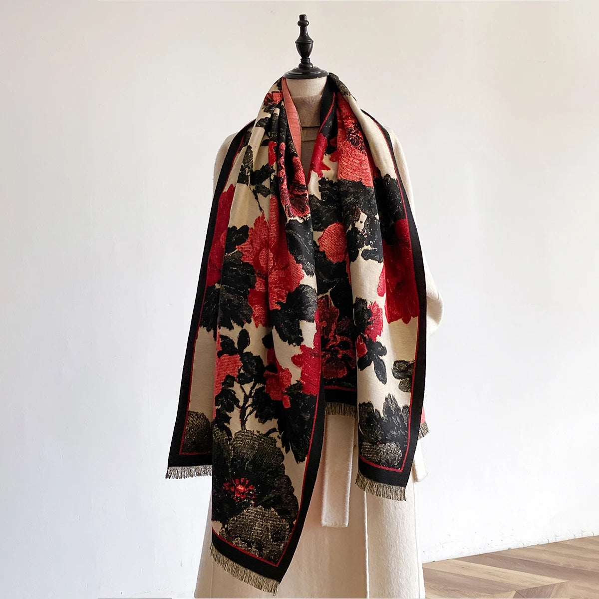 Floral patterned scarf on a mannequin against a plain background