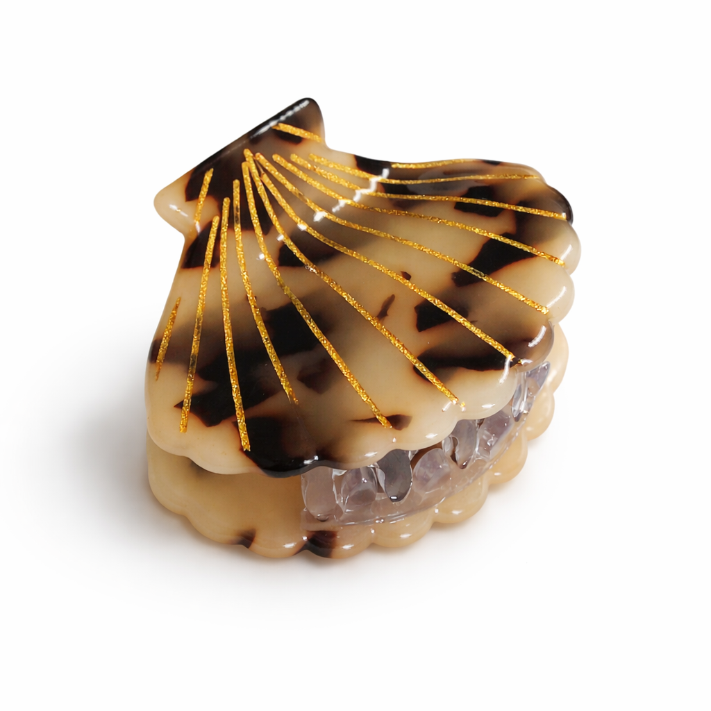 Shell-shaped object with a pattern on a white background