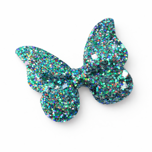 Glittery blue butterfly-shaped hair clip on a white background