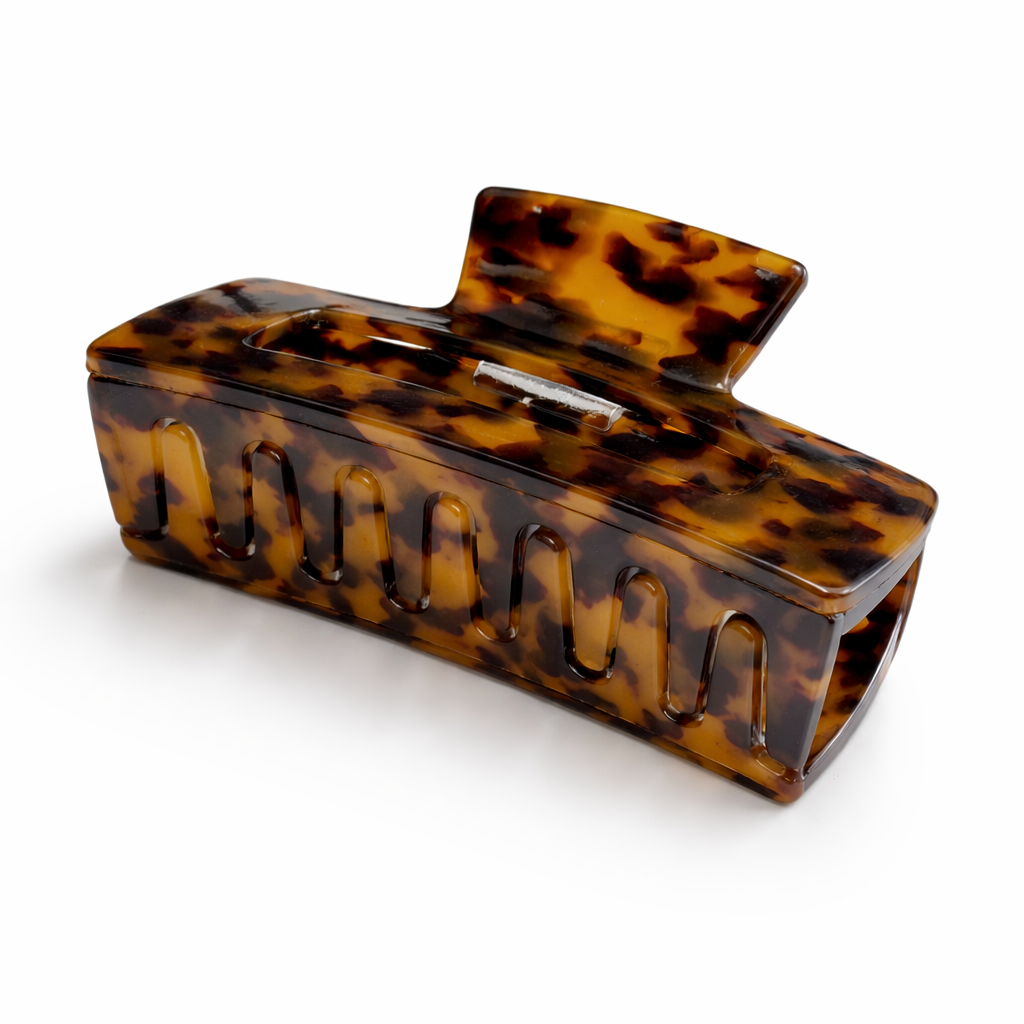 Tortoiseshell hair clip on a white background