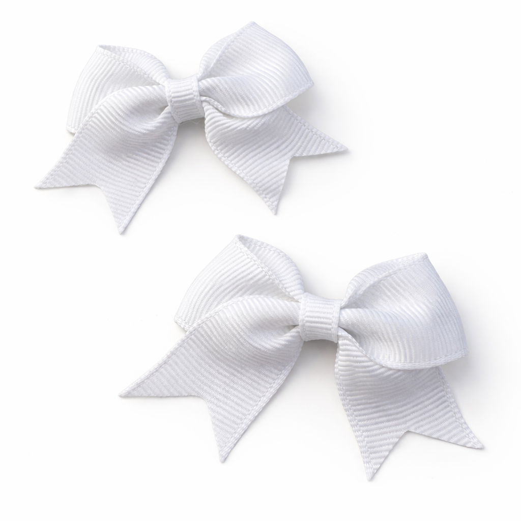 Two white hair bows on a white background