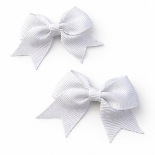 Two white hair bows on a white background