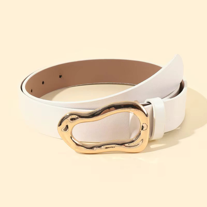 White belt with a gold buckle on a beige background