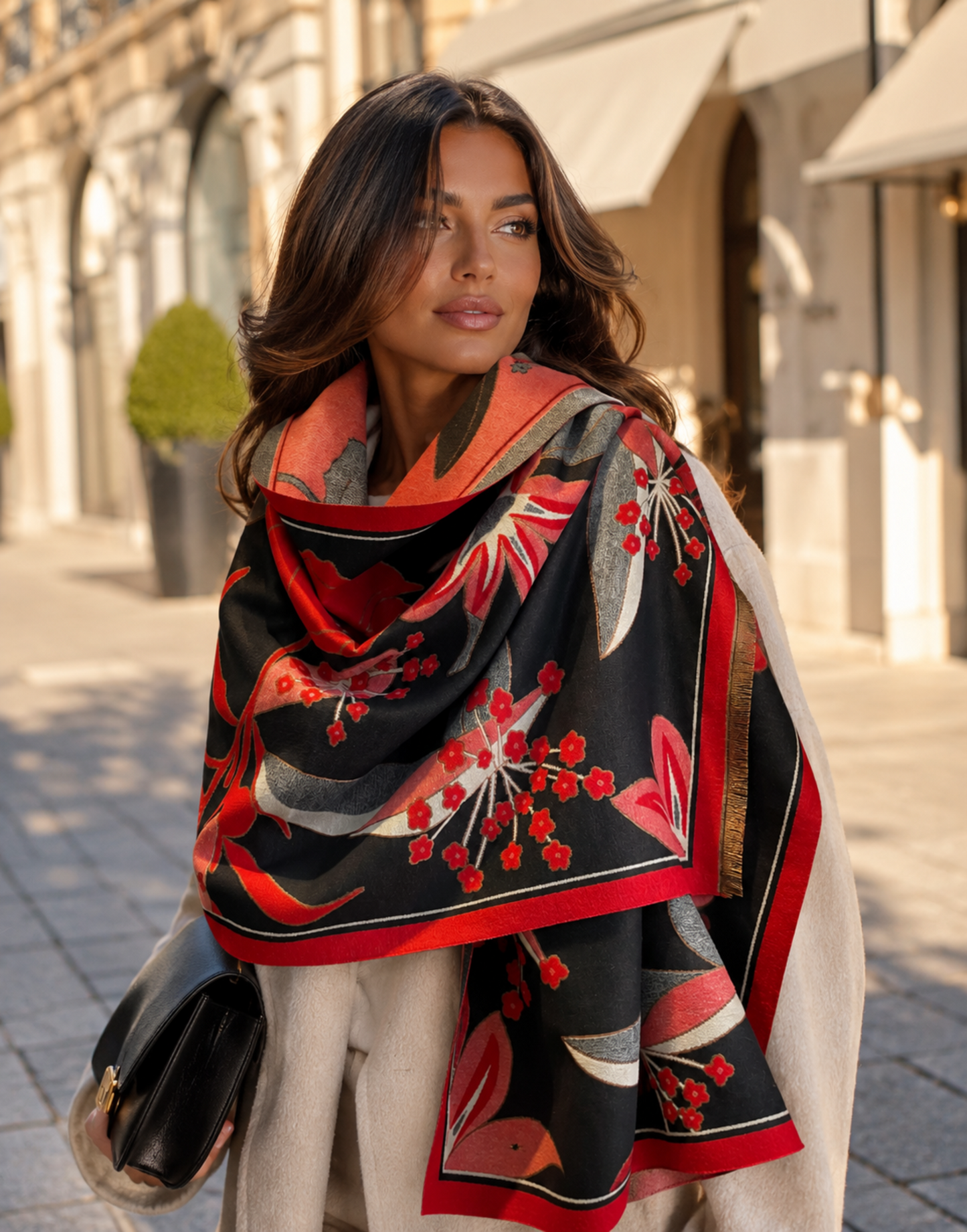 Woman wearing a colorful floral scarf in an urban setting