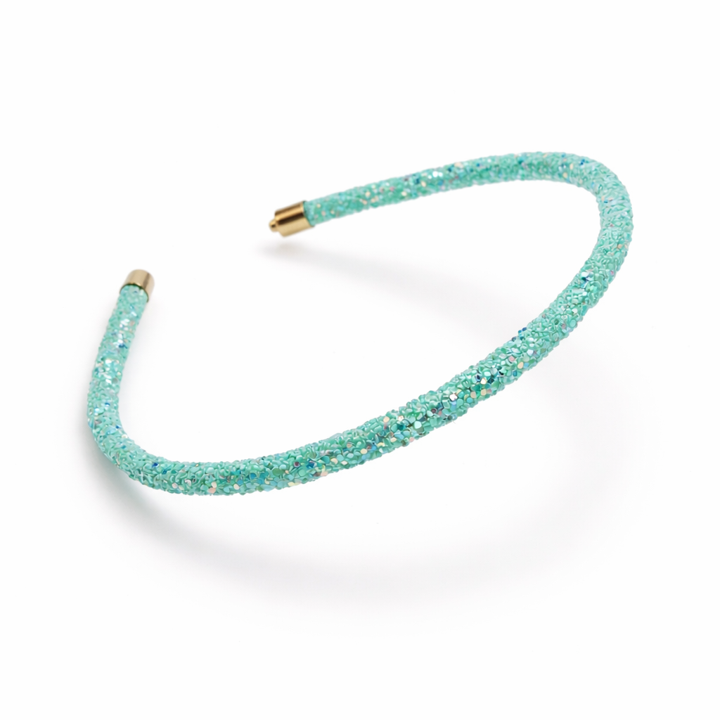 Turquoise headband with gold clasp on a white background