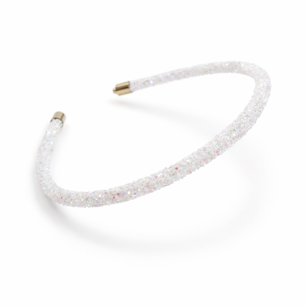 White headband with small embellishments on a white background