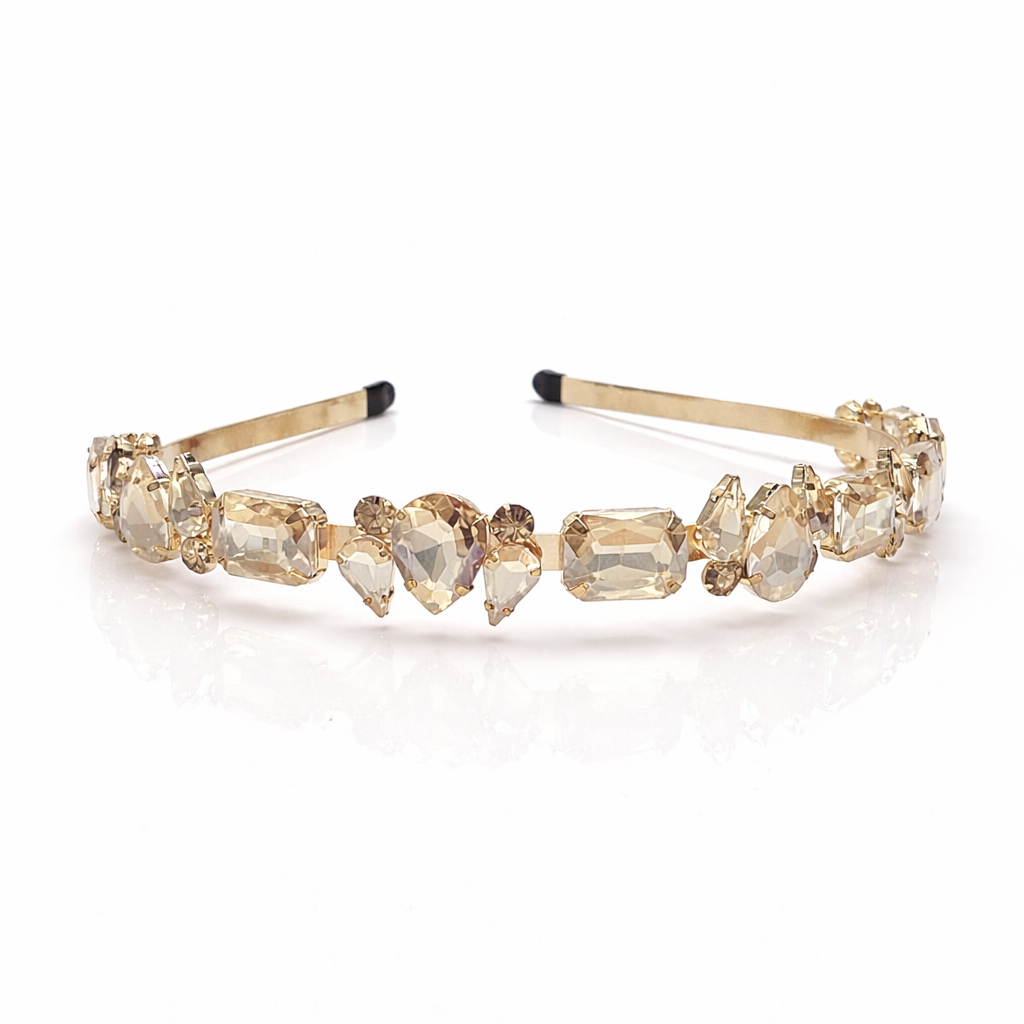 Gold headband with gemstones on a white background