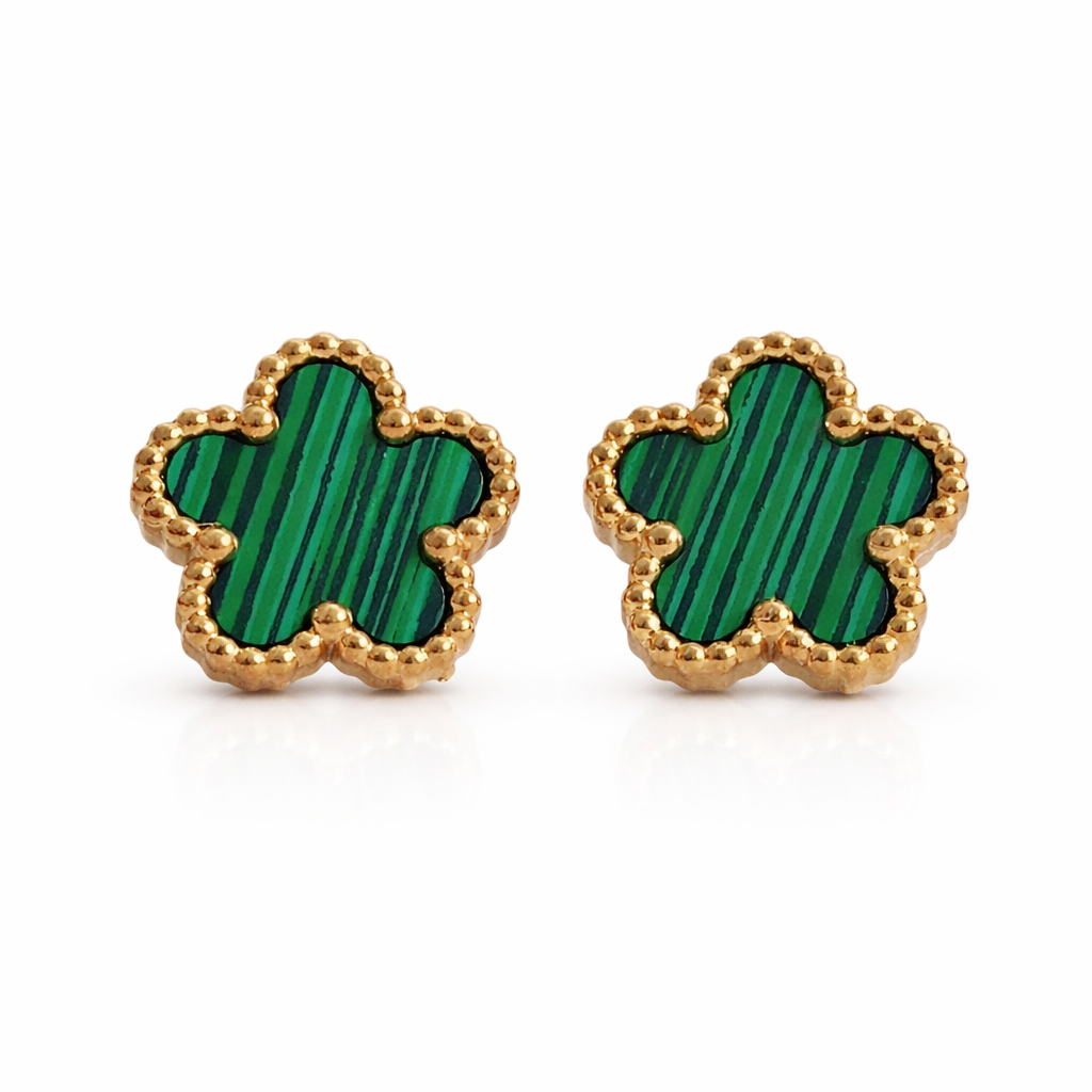 A pair of green floral stud earrings with gold-colored borders on a white background.