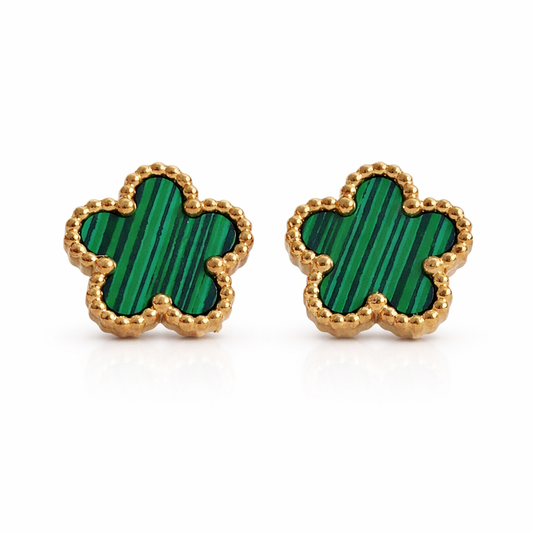 A pair of green floral stud earrings with gold-colored borders on a white background.