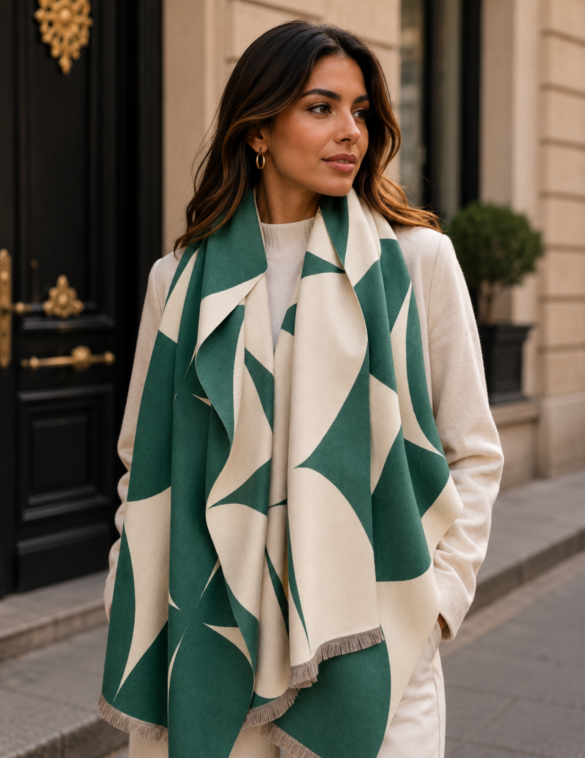 Woman wearing a green and white patterned scarf in an urban setting
