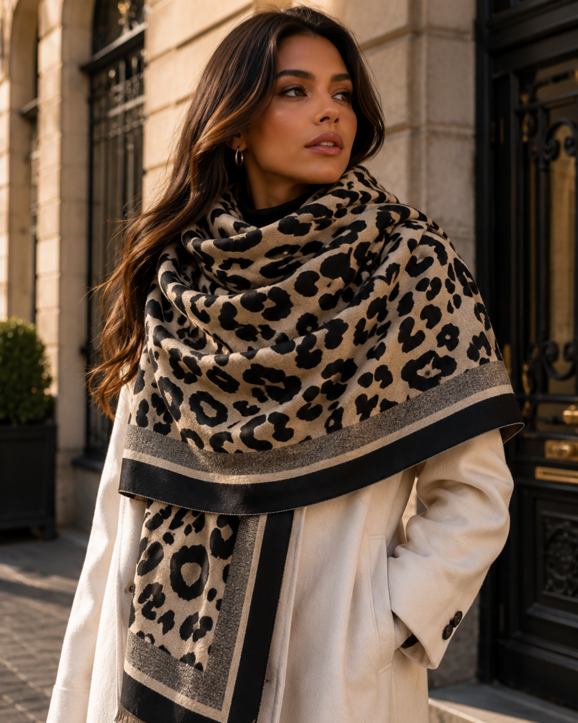 Woman wearing a leopard print scarf in an urban setting