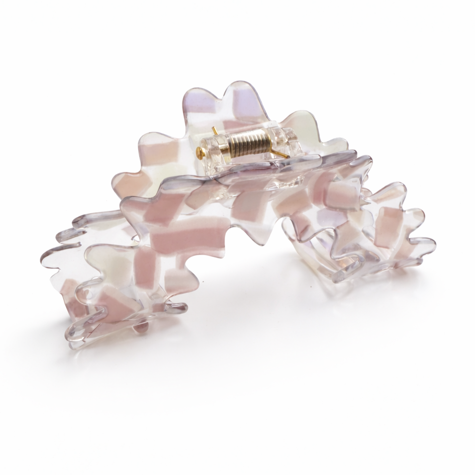 Pink floral hair clip on a white background