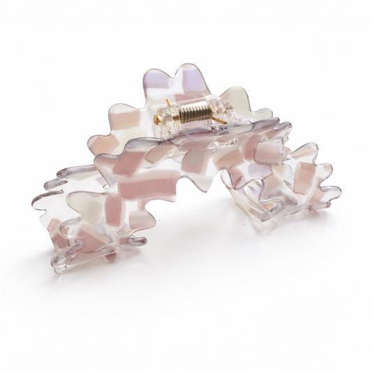 Pink floral hair clip on a white background