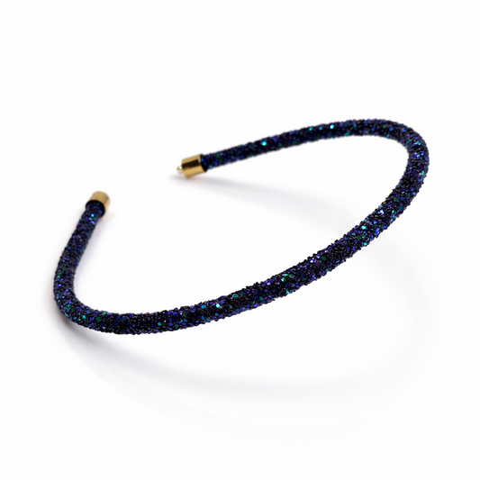 Navy blue beaded headband on a white background
