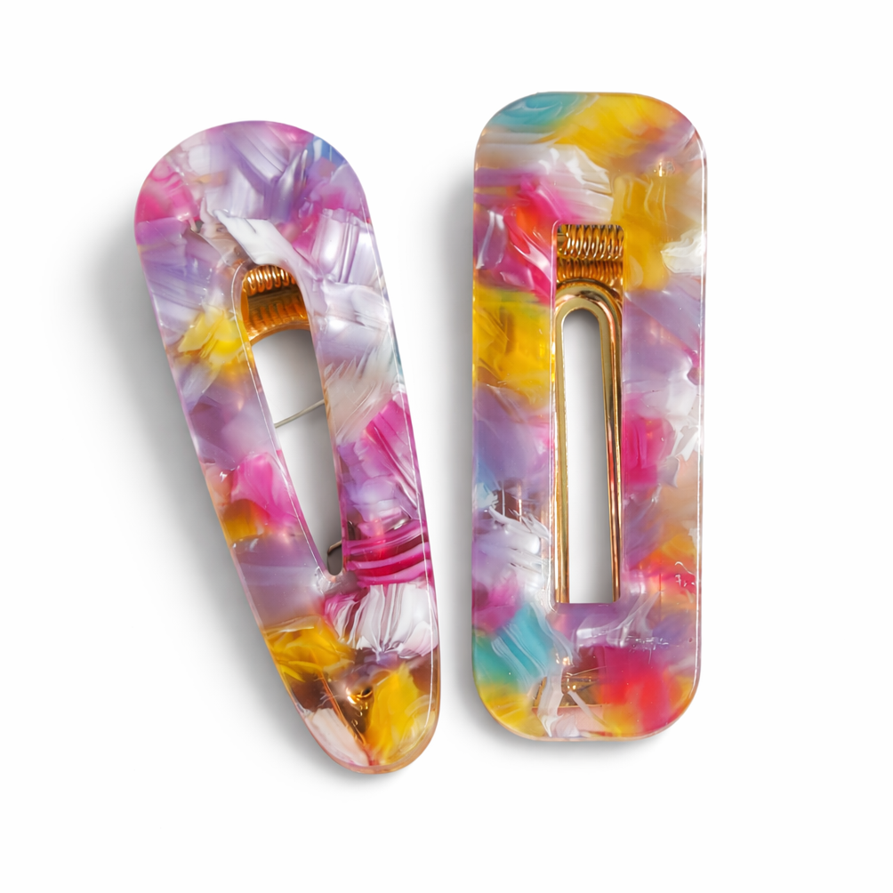 Two colorful hair clips with a floral pattern on a white background