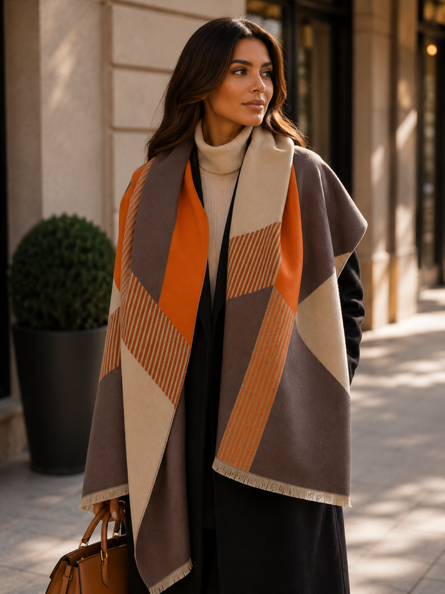 Woman wearing a patterned scarf on a city street