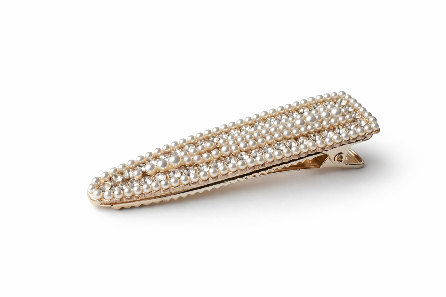 Gold hair clip with pearl embellishments on a white background