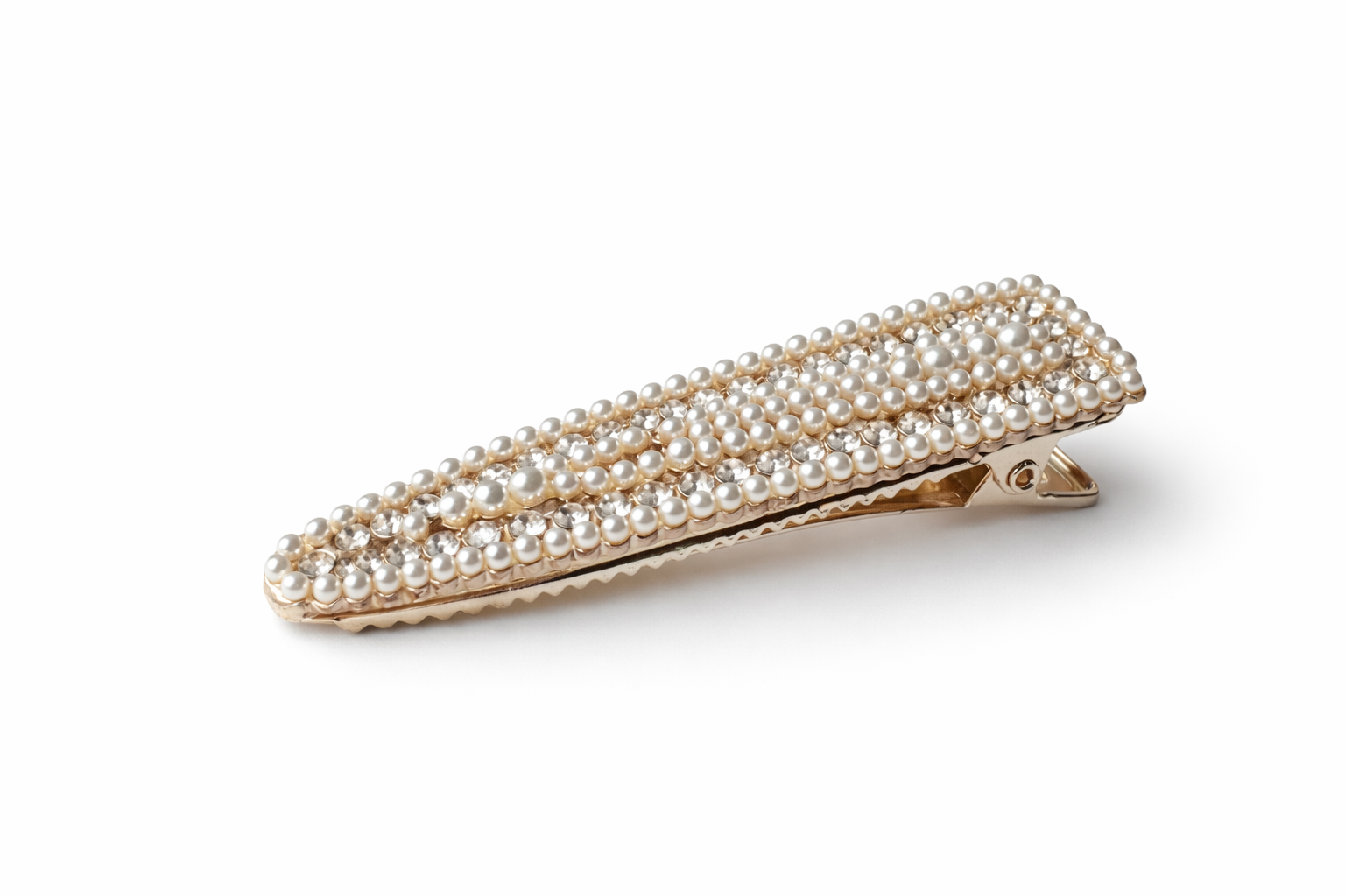 Gold hair clip with pearl embellishments on a white background