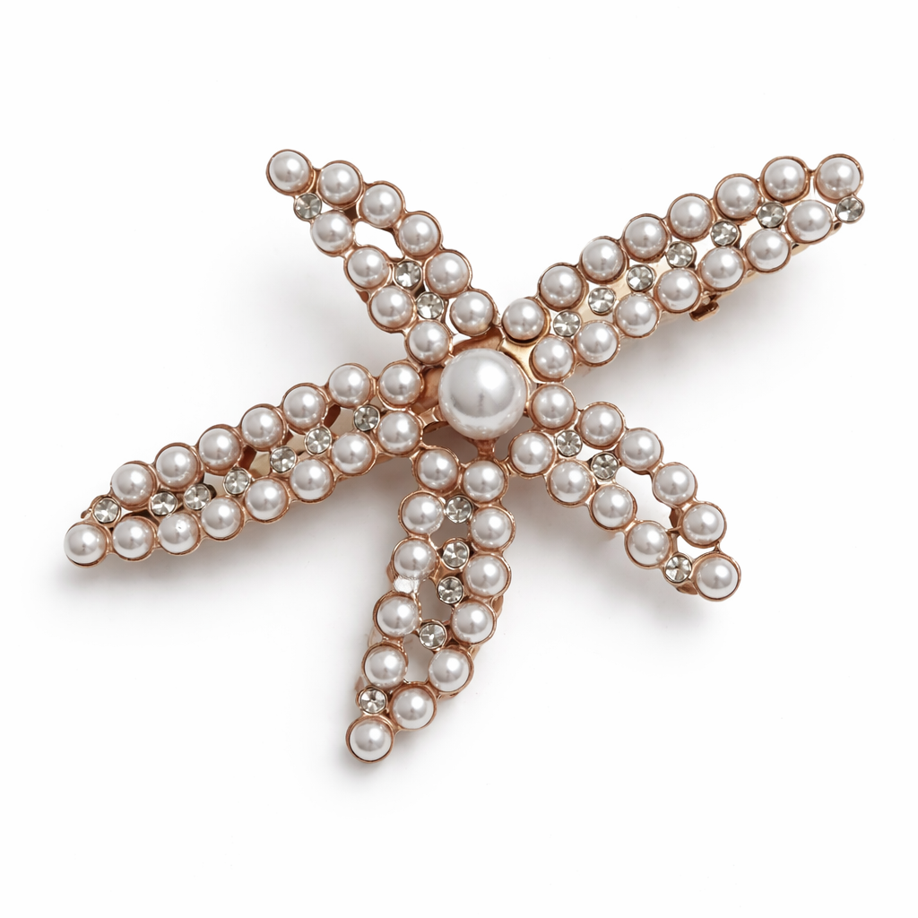 Starfish-shaped jewelry with pearls on a white background