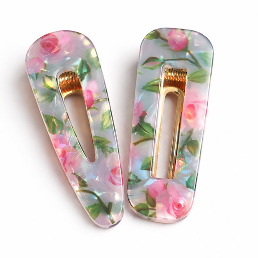 Pink rose resin hair clip with gold snap barrette photographed on a clean white background