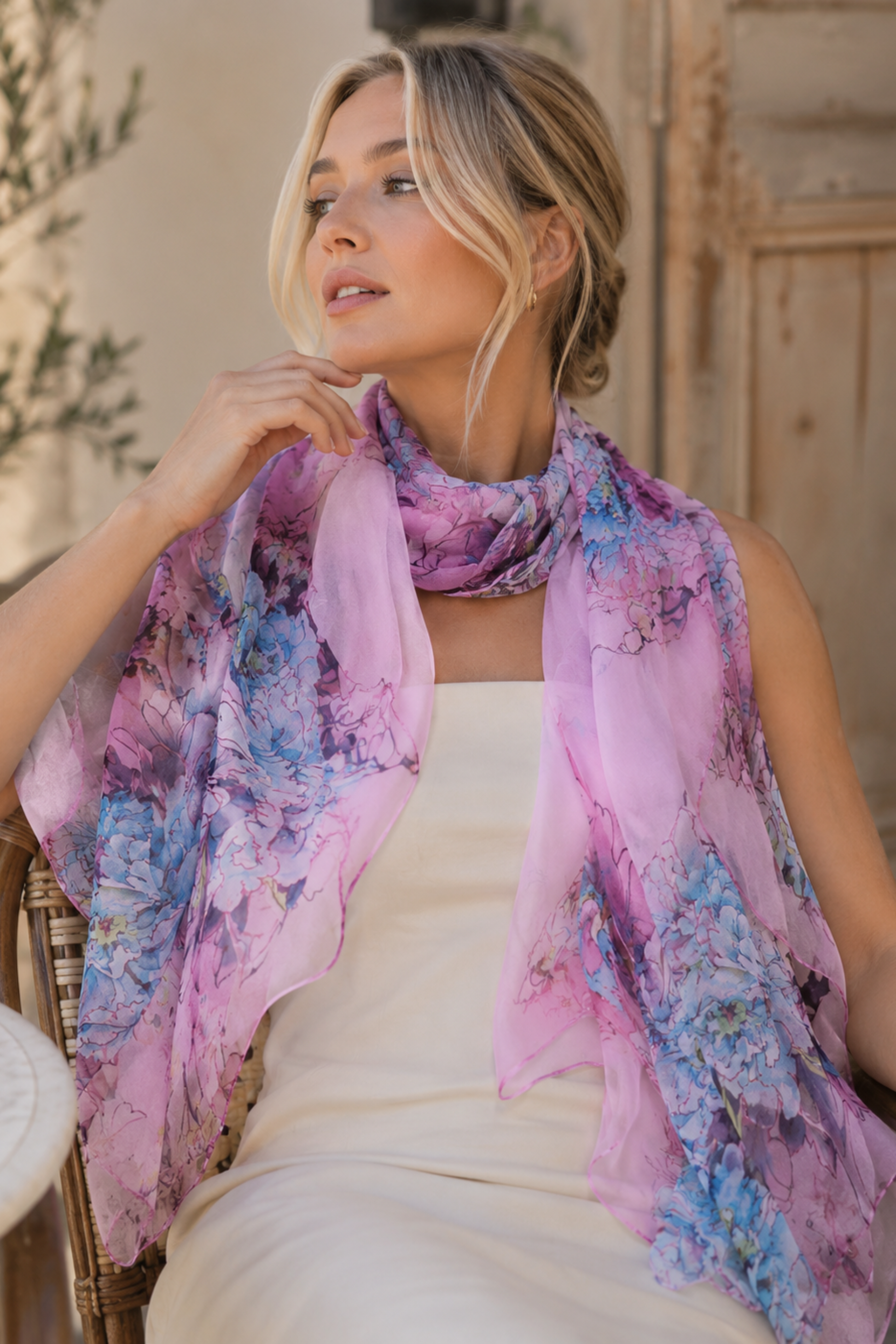 Woman wearing a colorful scarf in an outdoor setting