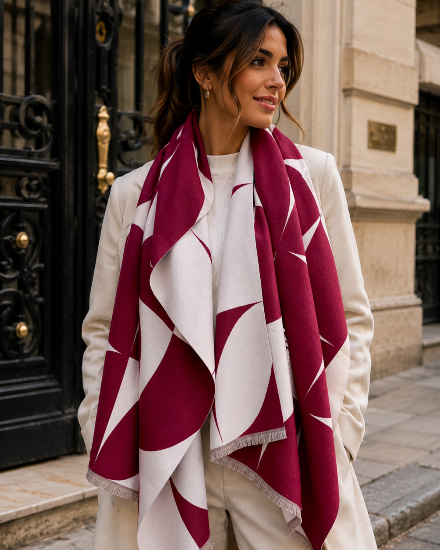 Woman wearing a red and white patterned scarf in an urban setting