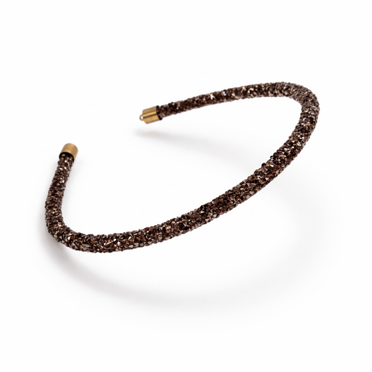 Black beaded headband on a white background