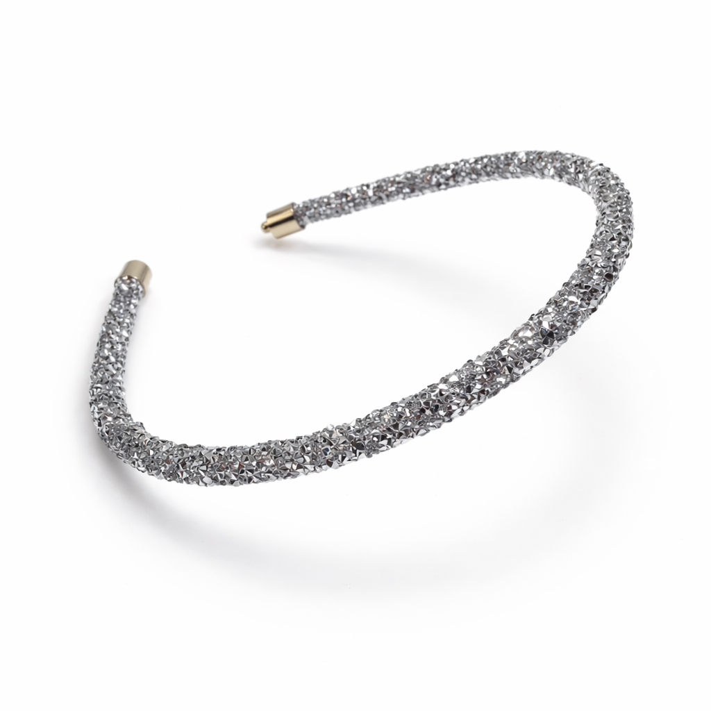 Silver glittery headband on a white background